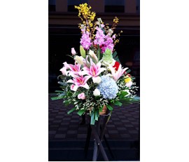 BK2 LARGE OPENING BASKET WITH LILIES & BLUE HYDRANGEAS