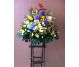 BK5 LARGE FLOWER BASKET WITH BIRD OF PARADISE, HYDRANGEAS, GERBERAS, LILIES & SEASONAL FLOWERS ON STAND