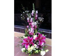T49 Tiger lilies with goldfish flowers table display
